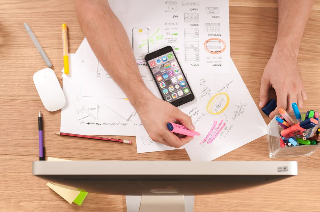 A wholesaler's hands rest on the table as he highlights his business plan.