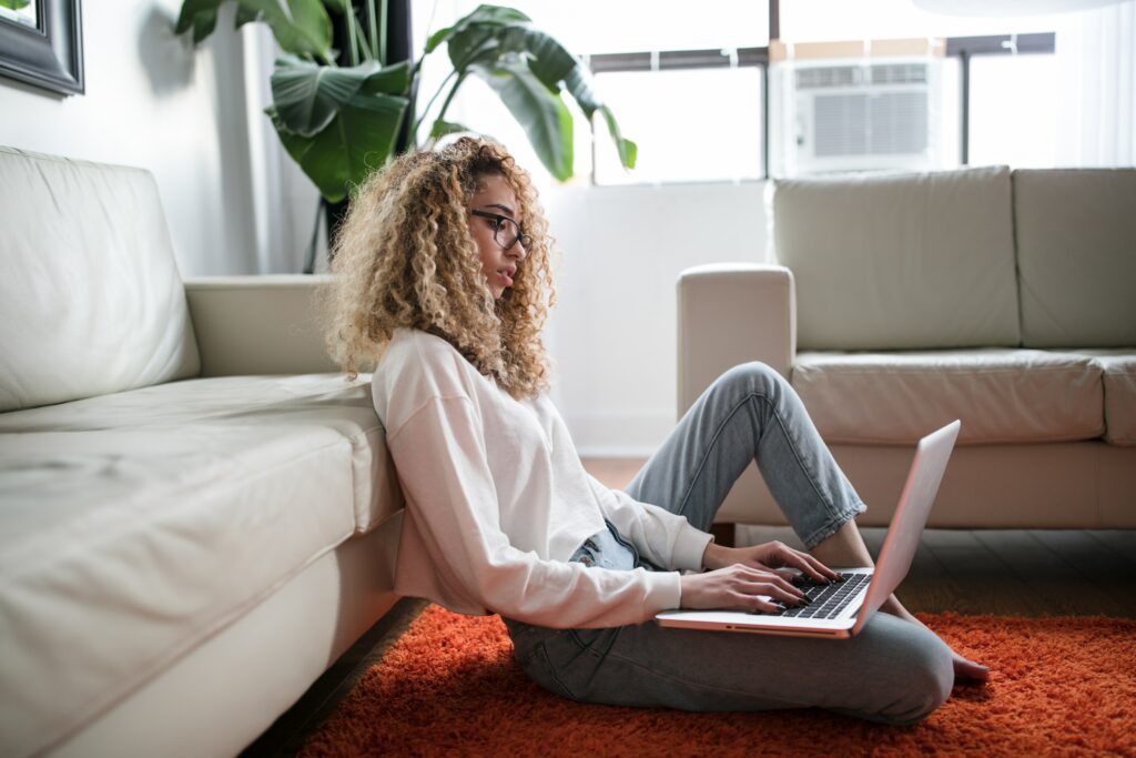 A Supplier sits on the floor and researches Amazon FBA options.